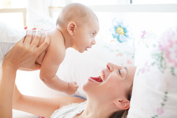 Mother playing with baby boy