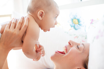 Mother playing with baby boy