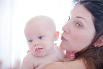 Mother holding baby girl