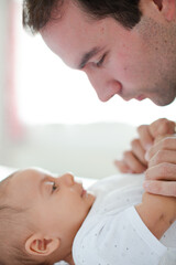 Obraz na płótnie Canvas Father adoring baby boy