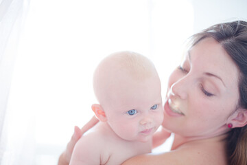 Mother holding baby girl
