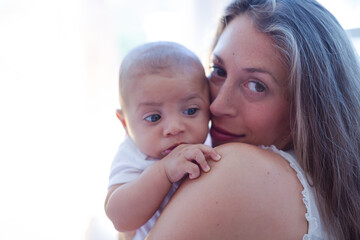 Mother holding baby boy
