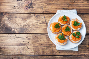 Sandwiches with bread zucchini caviar tomatoes onions. Homemade vegetarian food. Canned stewed vegetable. wooden background top view, copy space