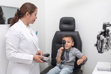 .Preventive health. Early detection of visual problems in children. Child performs vision test in...