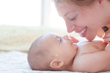Mother playing with baby boy