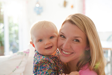 Mother holding baby girl