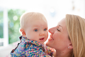 Mother holding baby girl