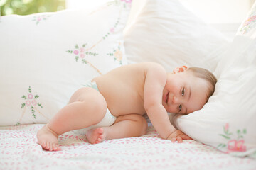 Baby boy smiling on bed