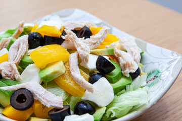 Diet salad with chicken breast and olives
