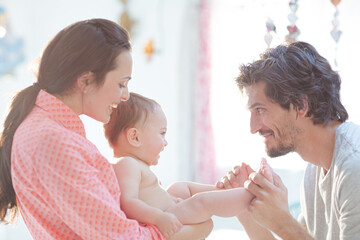 Parents playing with baby boy
