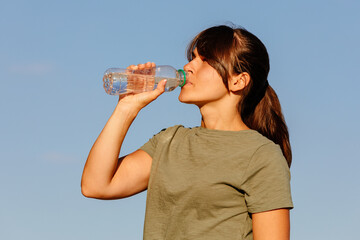 a girl drinks water after sport. healthy active lifestyle