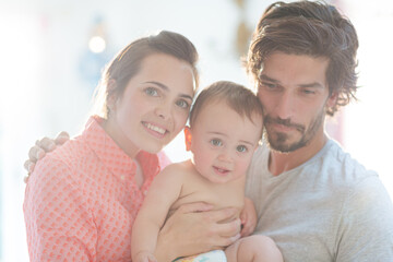 Parents smiling with baby boy