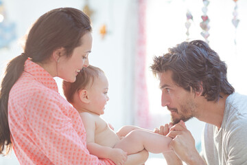 Parents playing with baby boy