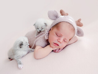 Newborn sleeping with kittens © tan4ikk