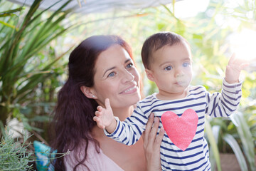 Mother holding daughter outdoors