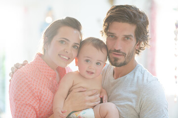Parents smiling with baby boy