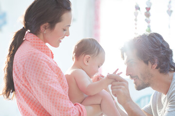 Parents playing with baby boy