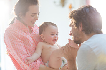 Parents playing with baby boy