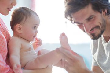 Parents playing with baby boy