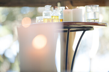 Essential oils and candles on table