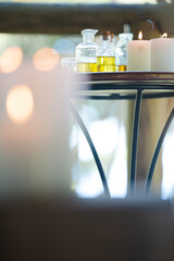 Essential oils and candles on table