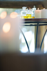 Essential oils and candles on table
