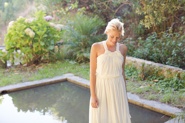 Naklejka premium Woman standing by pool outdoors