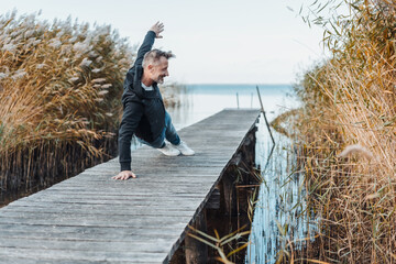 Fit athletic man working out doing yoga exercises