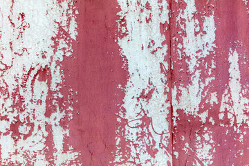 Naklejka premium Old painted cracked wall as an abstract background.