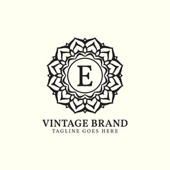 luxurious mandala vintage letter E vector logo design