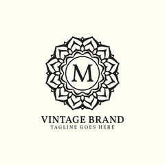 luxurious mandala vintage letter M vector logo design