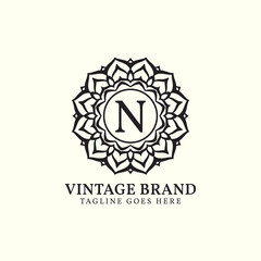 luxurious mandala vintage letter N vector logo design