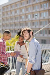 Man smiling on city street