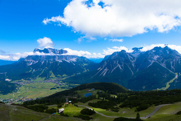 Panoramic view of the idyllic mountain backdrop. Popular holiday destination in the German Alps. Tourism and vacations concept. Bavaria, Germany