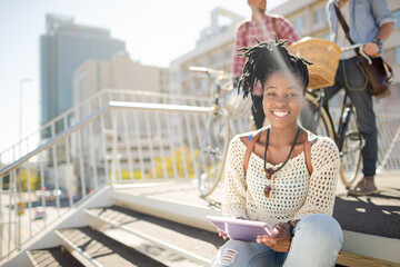 Woman posing with digital tablet