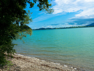 The Forggensee Lake, also known as the Roßhaupten reservoir, near Füssen. Panorama view.
