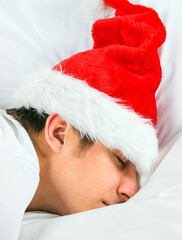 Young Man sleep in Santa Hat