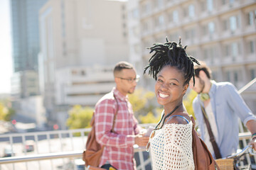 Woman smiling on city street