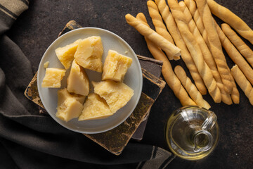 Grissini sticks and parmesan cheese. Traditional italian food.