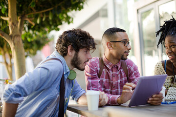 Friends talking at sidewalk cafe