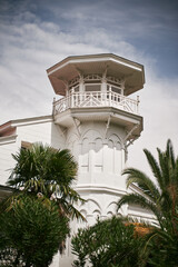 COrner tower building with white facade