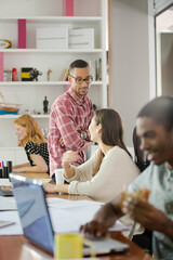 Man eating and working at conference tablet
