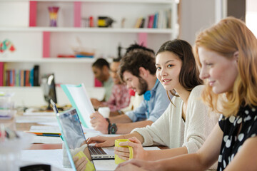 People working at conference table in office