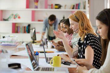 People working at conference table in office