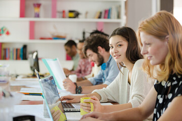 People working at conference table in office