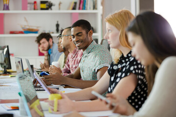 People working at conference table in office