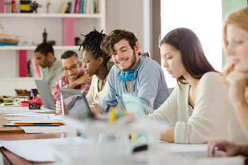 People working at conference table in office