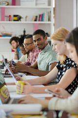 People working at conference table in office