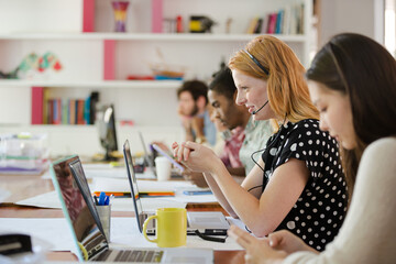 People working at conference table in office
