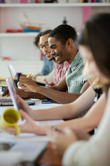 People working at conference table in office